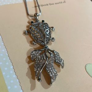 Long Silver tone chain with nice Fish Pendant Green eyes, and opaque Stone.